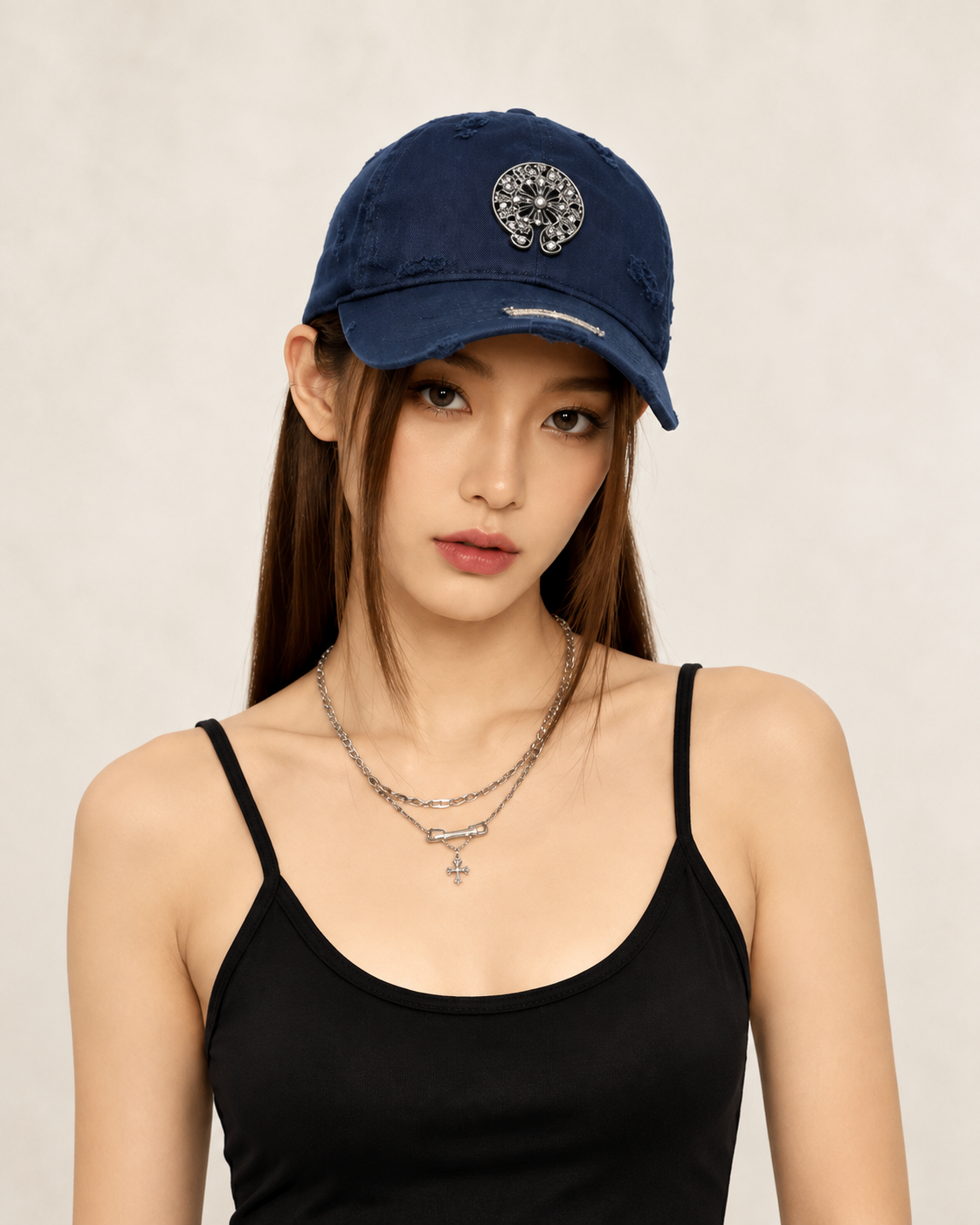 Headwear category — model wearing navy cap
